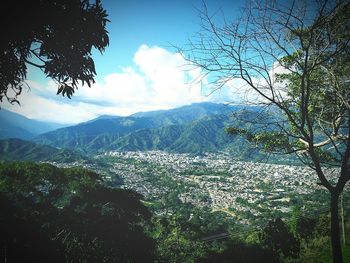 Scenic view of mountains against cloudy sky