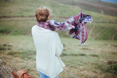 Rear view of a woman in a field