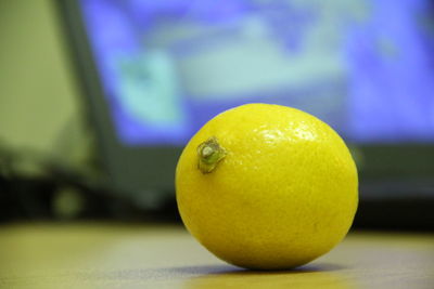 Close-up of lemon on table