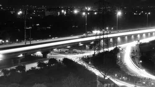 High angle view of illuminated highway in city at night