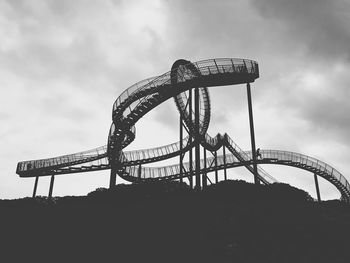 Low angle view of rollercoaster against sky