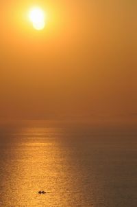 Scenic view of sea against clear sky during sunset