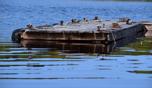 Boats moored in lake