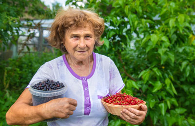 Portrait of woman holding food