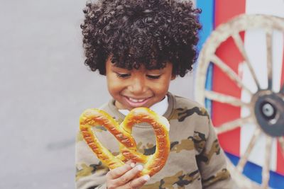 Portrait of cute girl holding toy