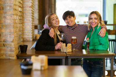 Portrait of siblings in cafe