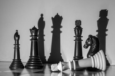 Close-up of chess pieces on table