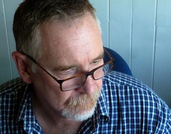 Close-up of man wearing eyeglasses