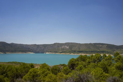 Scenic view of sea against clear blue sky