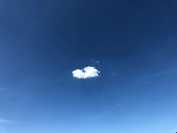 Low angle view of moon against blue sky
