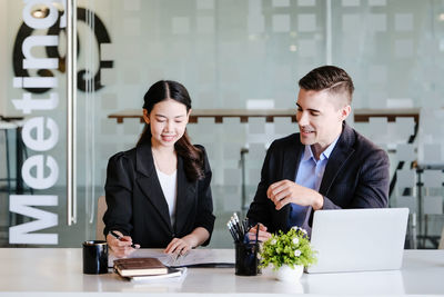 Business colleagues working at office