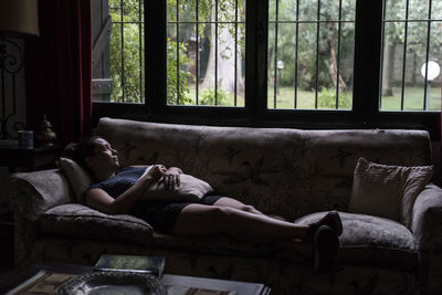 Man relaxing on sofa at home