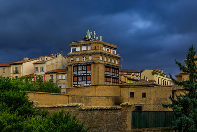 Buildings in city against sky