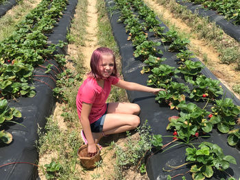 Portrait of smiling girl with plants