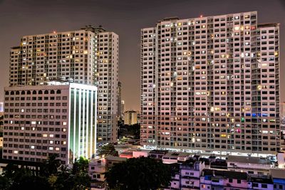 High angle view of buildings in city at night