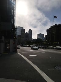 City street and buildings against sky