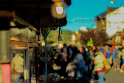 Illuminated lanterns hanging in city at night