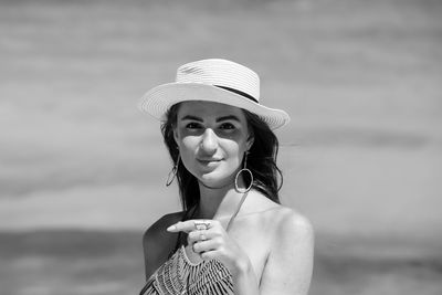 Portrait of young woman in hat