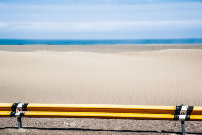 High angle view of yellow beach against sky