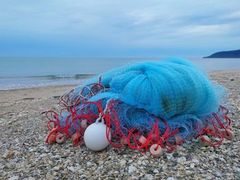 Close-up of fishing net on beach