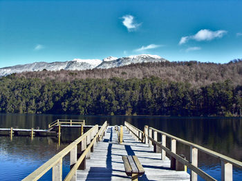 Pier over lake against sky