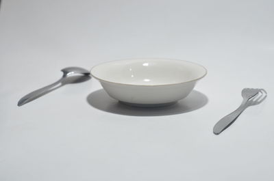 High angle view of coffee on table against white background