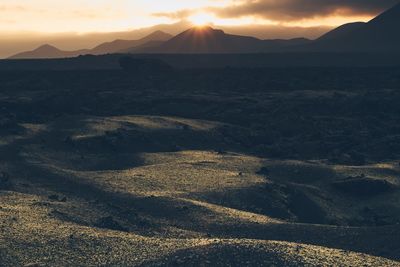 Scenic view of landscape against sky during sunset