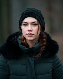 Portrait of young woman standing outdoors