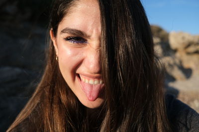 Close-up portrait of smiling young woman