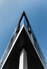 Low angle view of building corner against sky