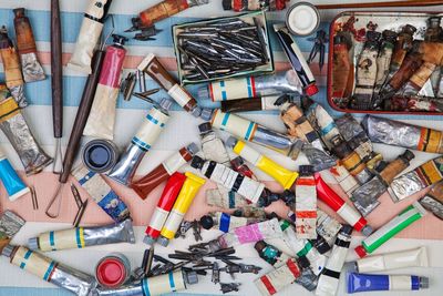 Directly above shot of watercolor tubes on table