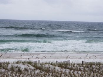 Scenic view of beach against clear sky