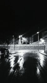 Illuminated bridge at night