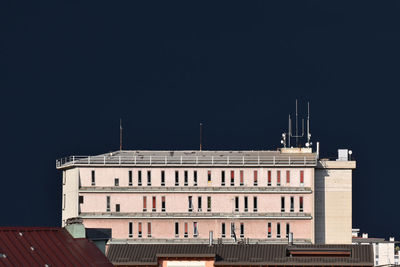 Low angle view of building against clear sky at night