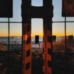 Low angle view of text on fence