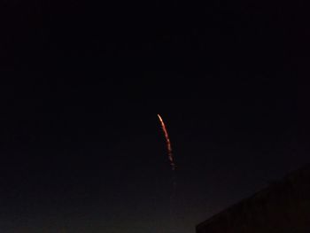 Low angle view of moon against sky at night