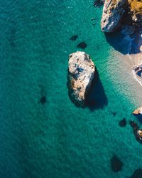 High angle view of rocks in sea