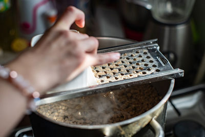 Close-up of person preparing food