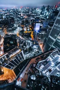 Aerial view of illuminated cityscape at night