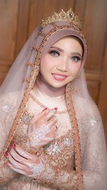 Portrait of bride wearing wedding dress