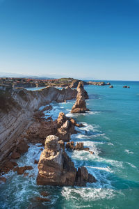 Scenic view of sea against clear blue sky