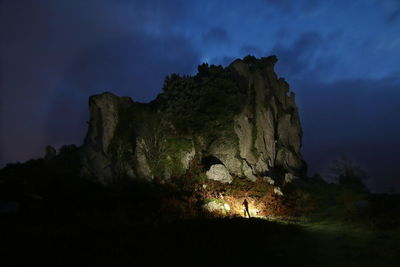 Low angle view of rock formation at night