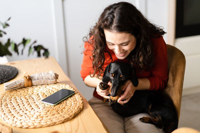 Girl playing with dog