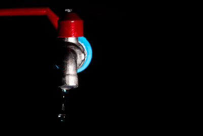 Close-up of water drop against black background