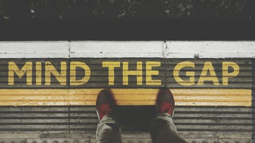 Low section of people standing on footpath