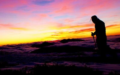 Man photographing on rock