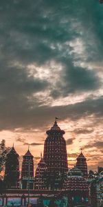 Panoramic view of buildings in city against sky during sunset