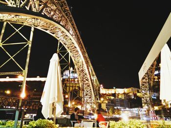 Illuminated ferris wheel at night
