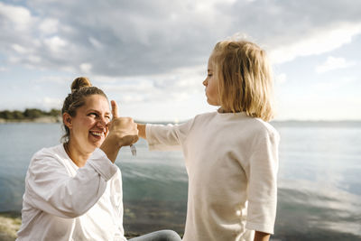 Mother with daughter at sea