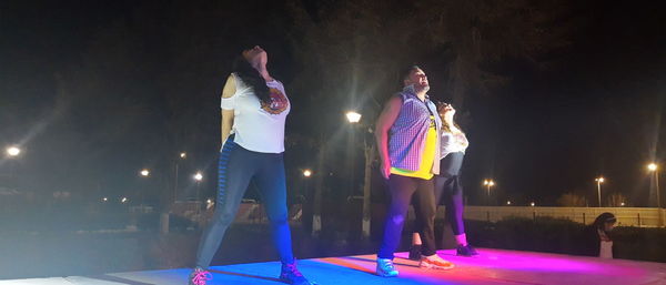 People at illuminated music concert